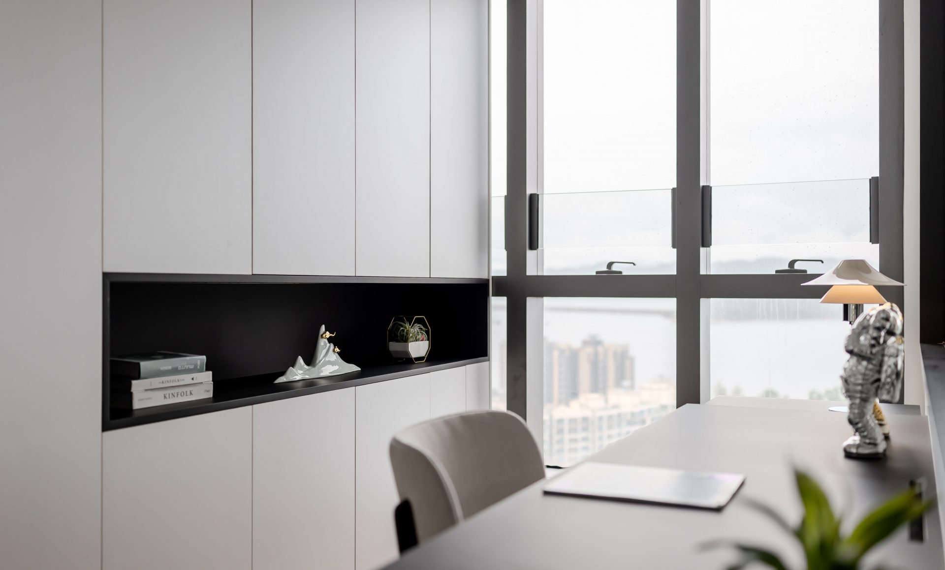 Double Cove — window-side desk with white built-in cabinetry