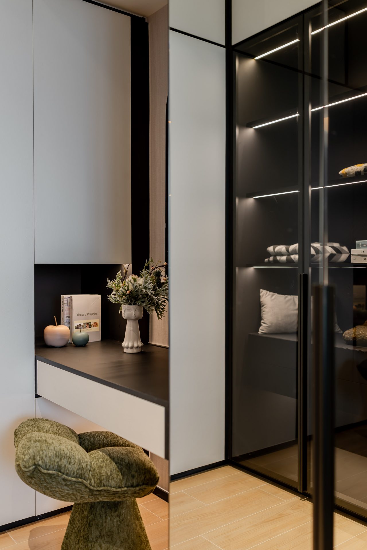 Double Cove — dark timber display shelving with warm lighting and decorative objects