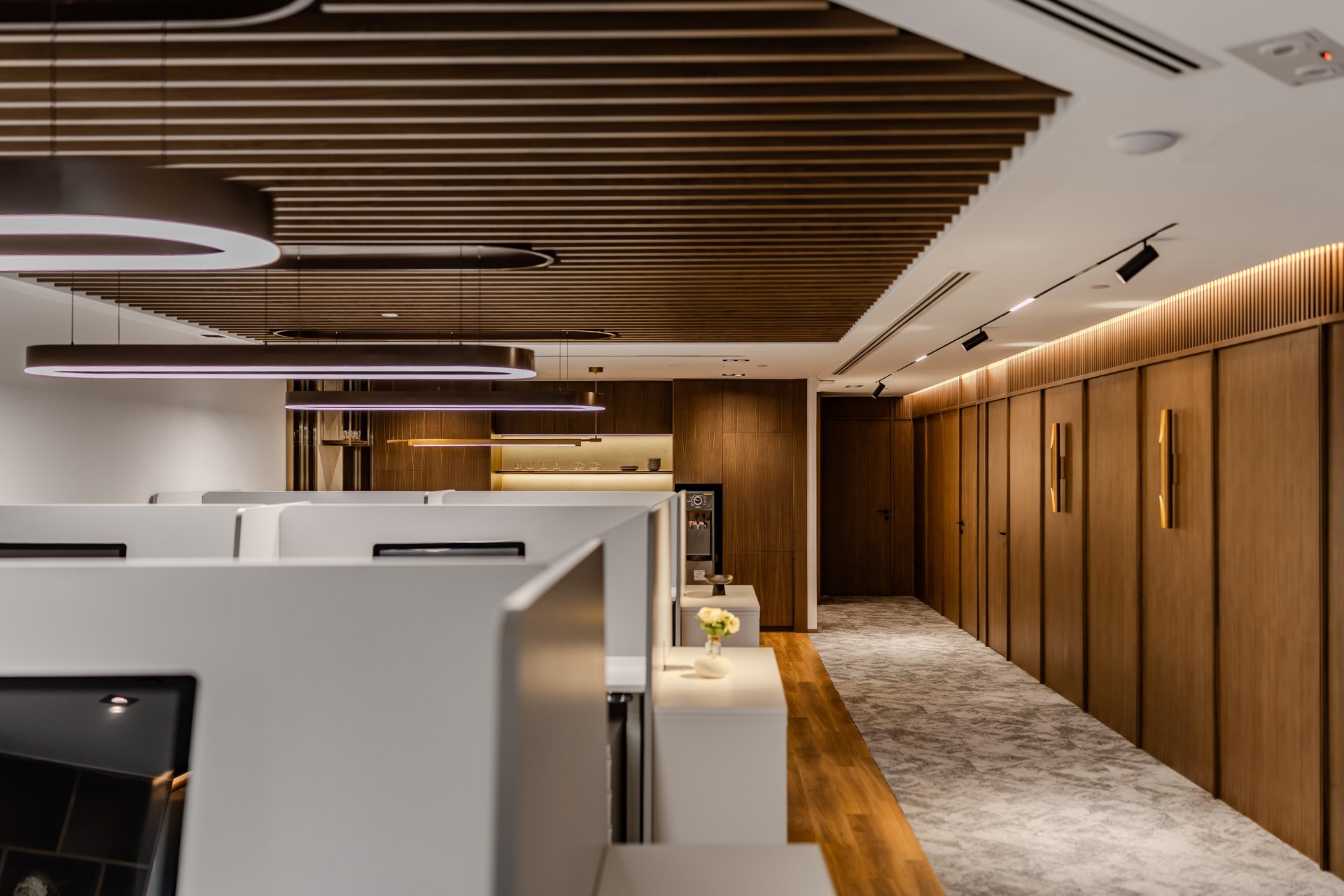 Han’s Laser Office — The open-plan office area uses a timber ceiling grille to define the space while maintaining fluid circulation, facilitating daily collaboration among the team.