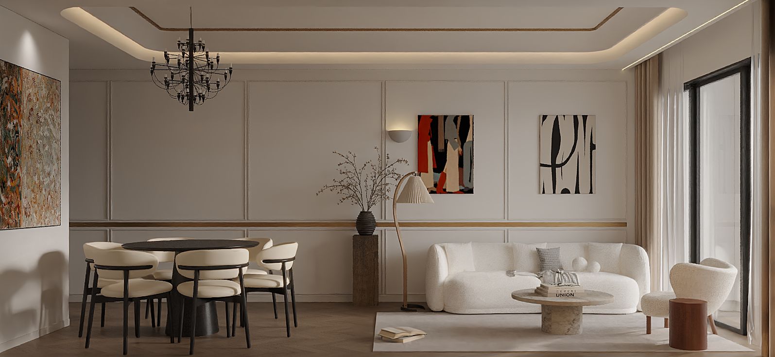 VICTORIA VOYAGE — The dining area features a round table paired with a statement chandelier, set against walls divided by clean lines and accented with artwork to elevate the elegant texture.